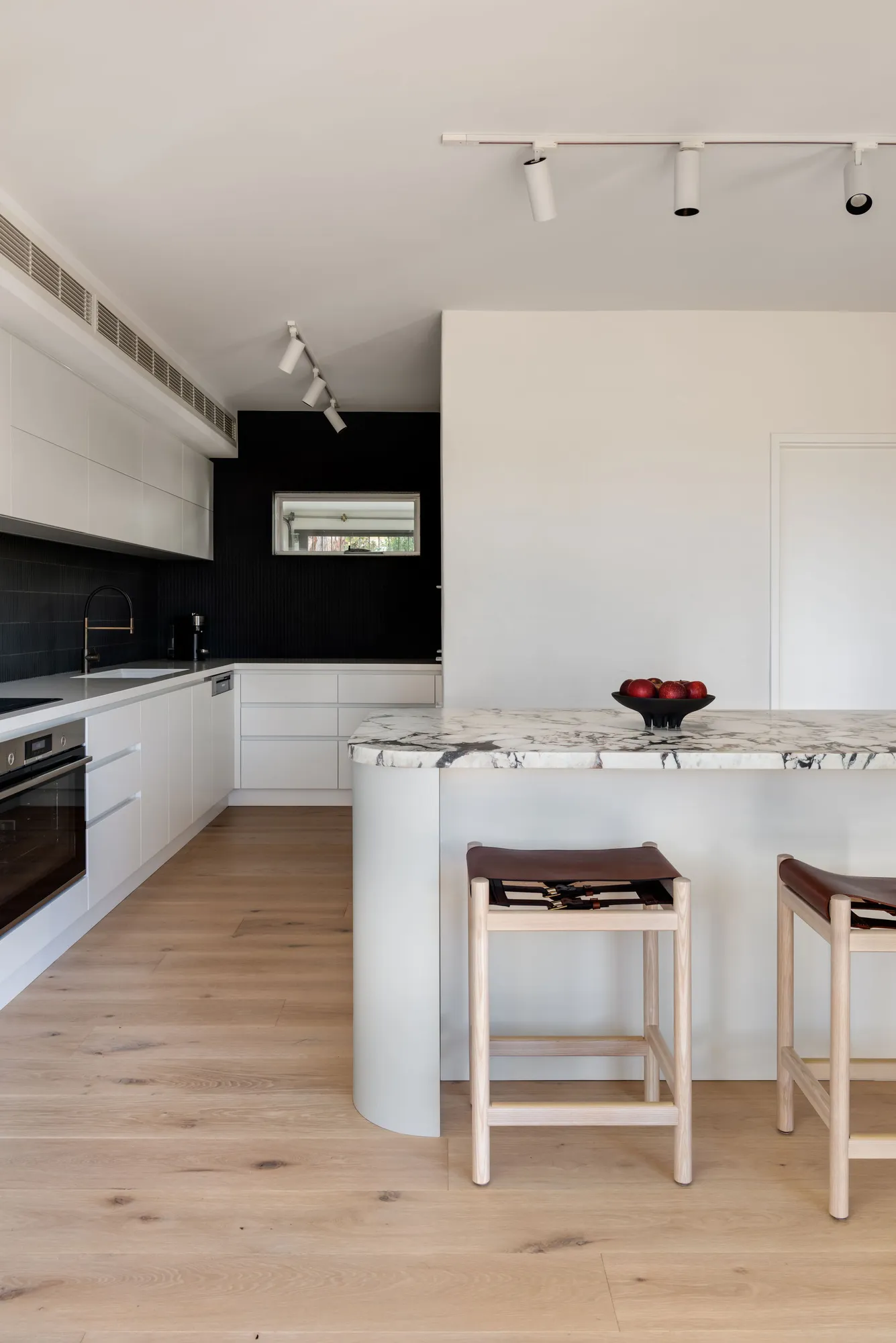 Kitchen design with marble island bench and custom cabinetry by Collected Interiors Perth